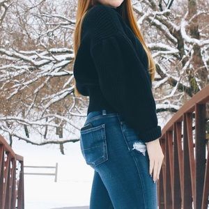 Oversized black sweater, kind of has a turtleneck